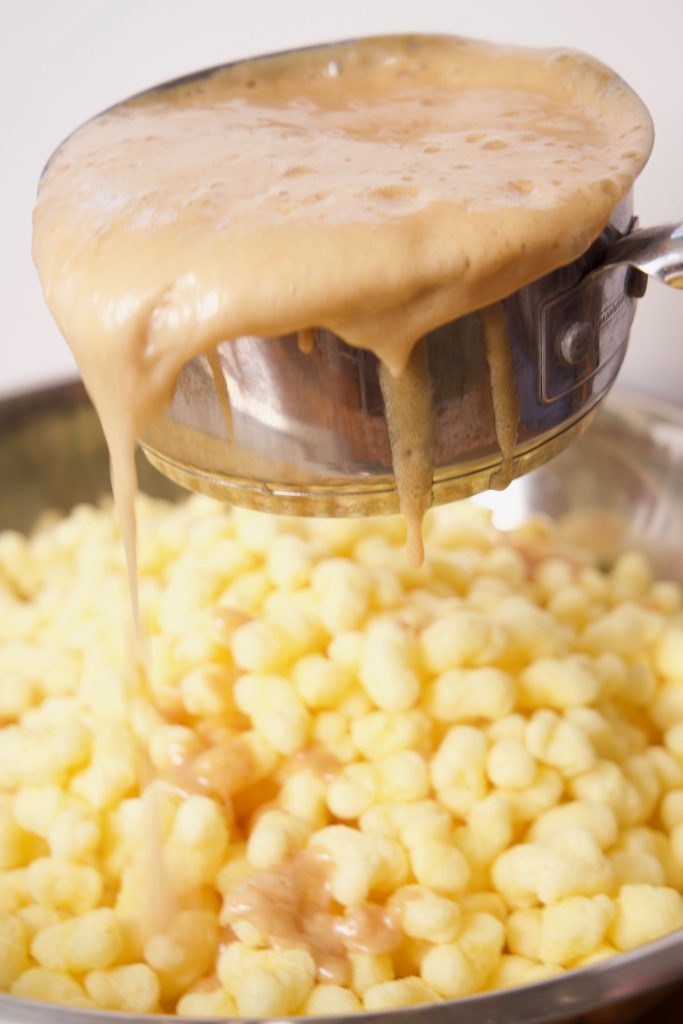 pouring over the puff corn