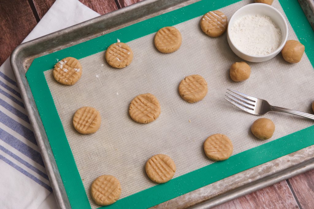 pressing peanut butter cookies